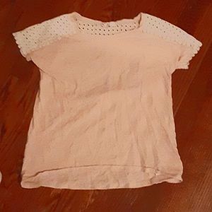 Light pink tee with cutouts.
